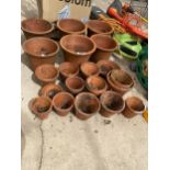 A COLLECTION OF ASSORTED TERRACOTTA GARDEN PLANTERS