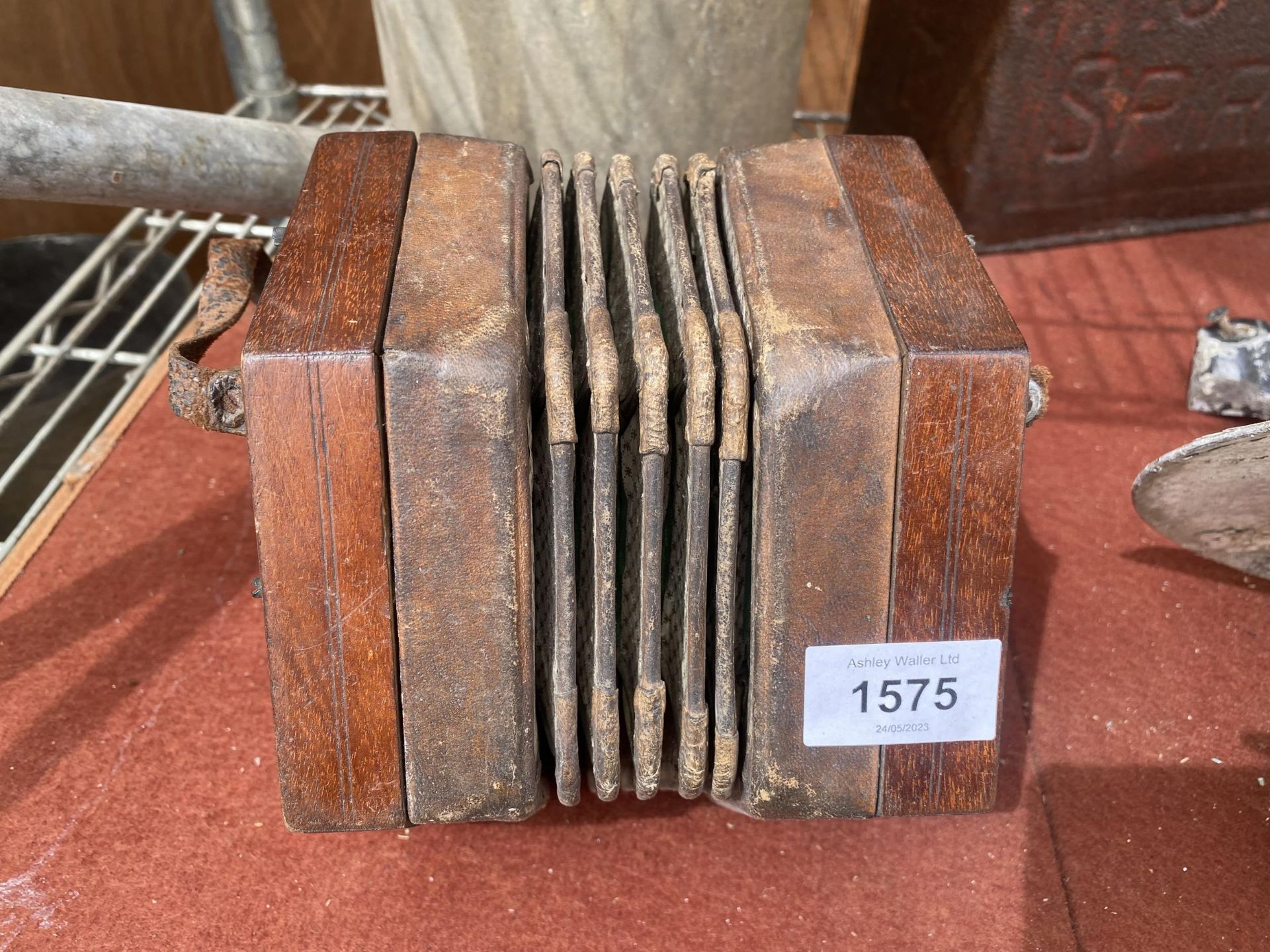 A VINTAGE WOODEN ACCORDION