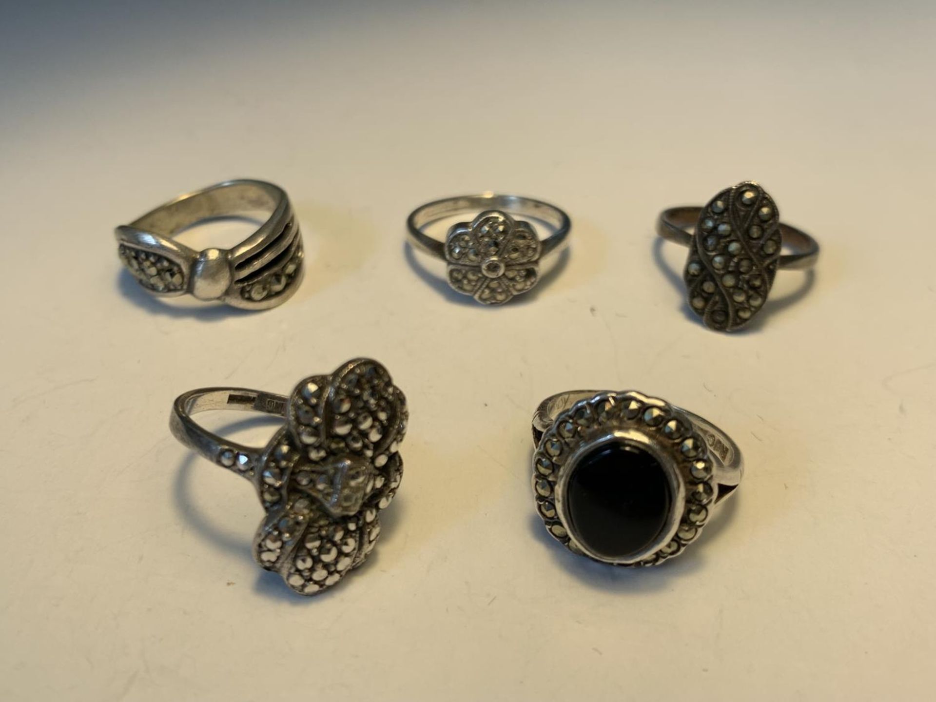 FIVE SILVER RINGS