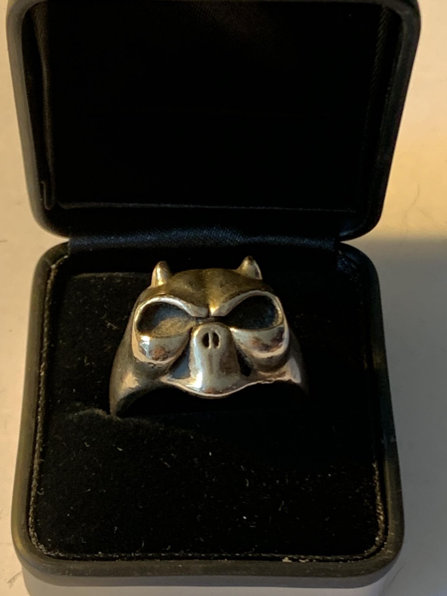 A LARGE SKULL RING IN A PRESENTATION BOX