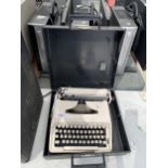 A REMINGTON TEN FORTY TYPE WRITER WITH CASE
