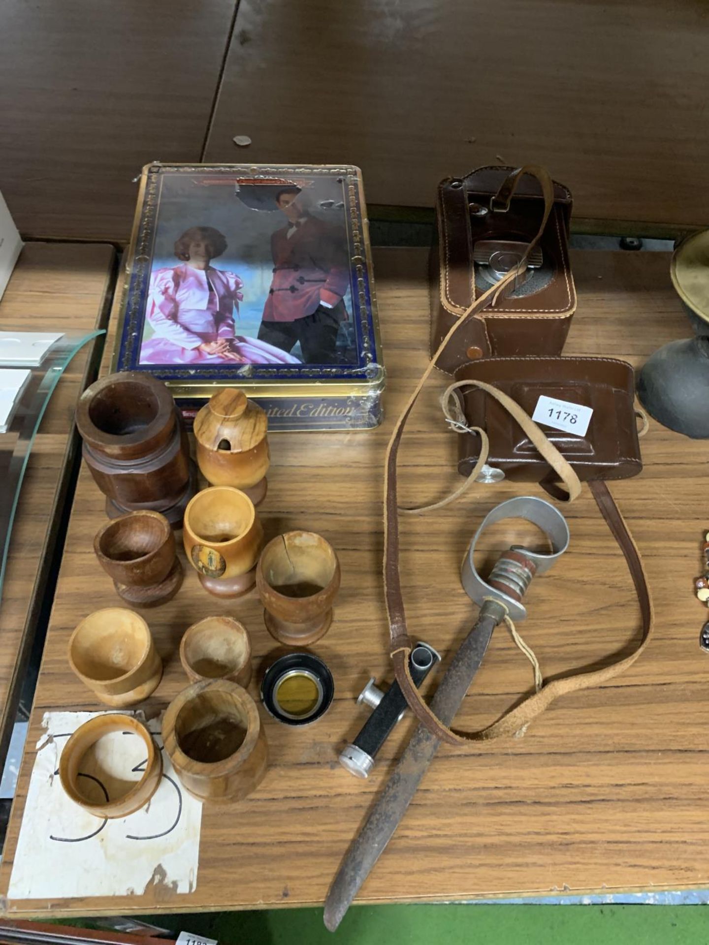 A GROUP OF WOODEN CUPS, VINTAGE CASED CAMERA ETC