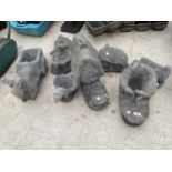 AN ASSORTMENT OF RECONSTITUTED STONE GARDEN ORNAMENTS TO INCLUDE BOOTS, COTTAGES AND PLANTERS ETC