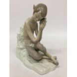 A LLADRO "SATYR WITH SNAIL" FIGURINE - 22 CM (H) 17 CM (W) - RETIRED