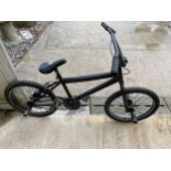 A CHILDS BMX BIKE WITH REAR STUNT PEGS