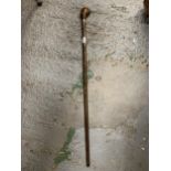 A VINTAGE WALKING STICK WITH SEAL HEAD TOP