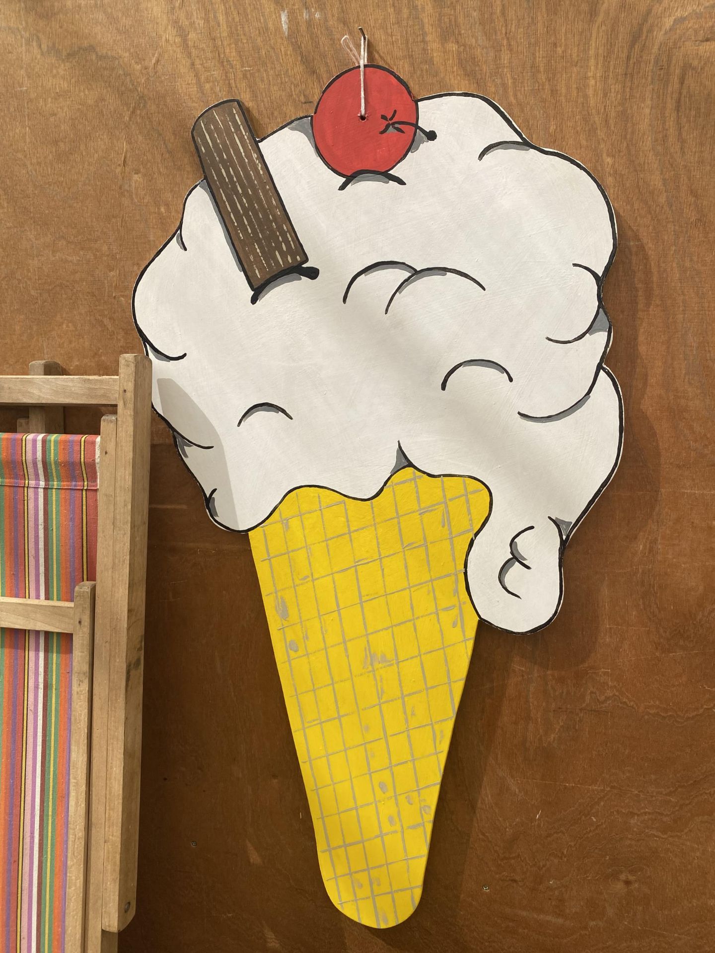 A PAINTED WOODEN ICE CREAM SHOP DISPLAY SIGN