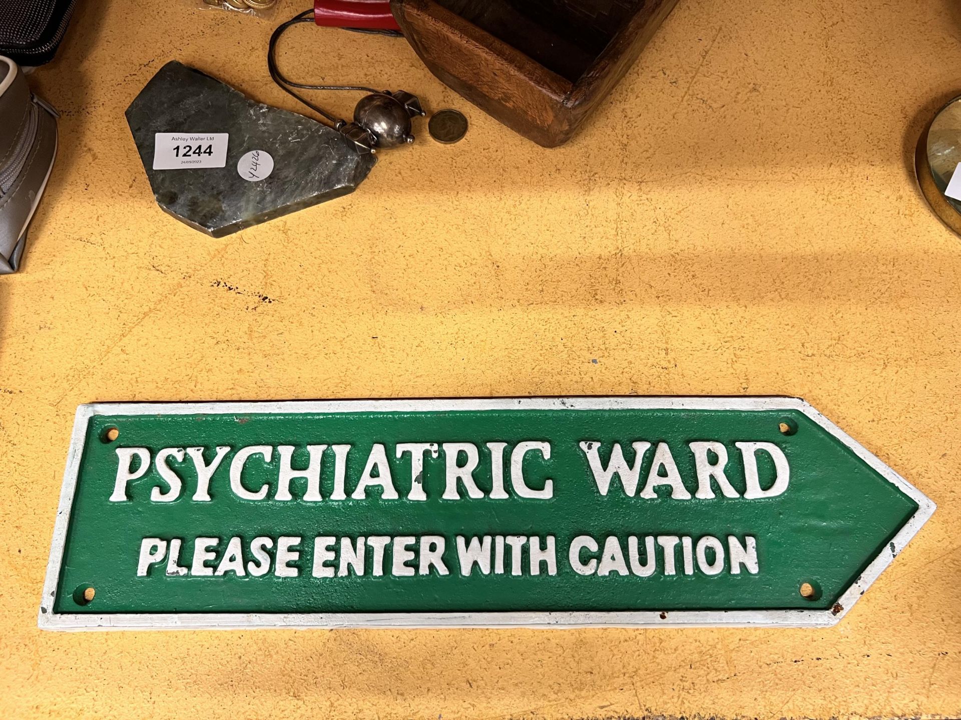 A CAST IRON PSYCHIATRIC WARD SIGN