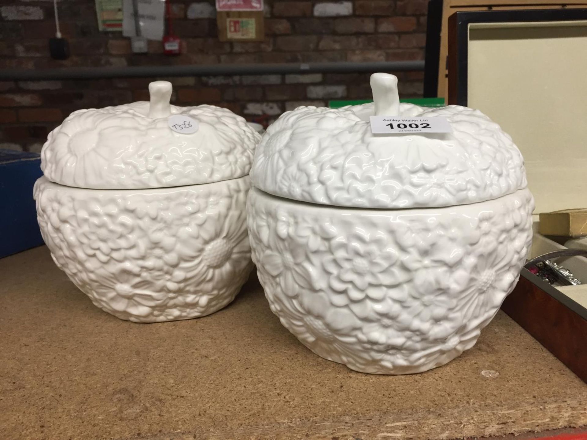 TWO LARGE APPLE SHAPED CANDLE HOLDERS WITH CANDLES