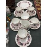 A PARAGON 'MICHELLE' CHINA TEASET TO INCLUDE A CAKE PLATE, SUGAR BOWL, CREAM JUG, CUPS, SAUCERS
