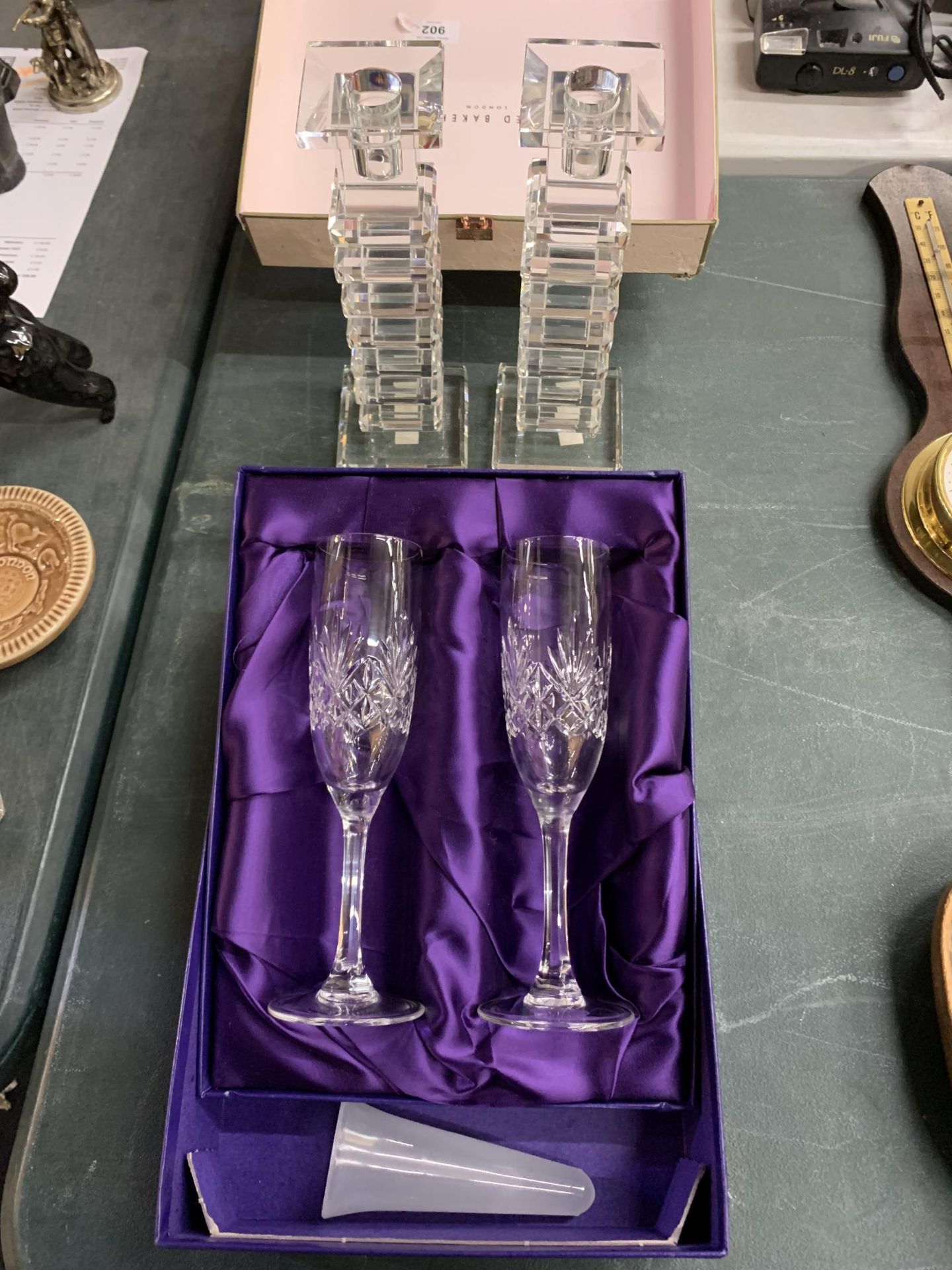 A PAIR OF BOXED EDINBURGH CRYSTAL CHAMPAGNE FLUTES PLUS A PAIR OF GALWAY CRYSTAL CANDLESTICKS