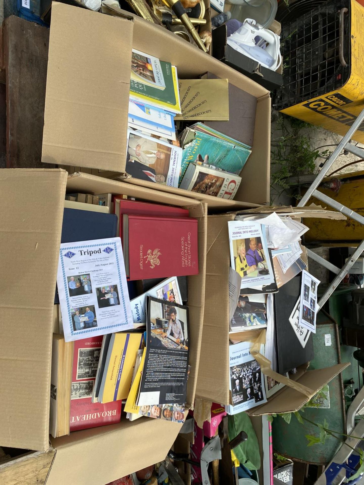 A LARGE ASSORTMENT OF BOOKS