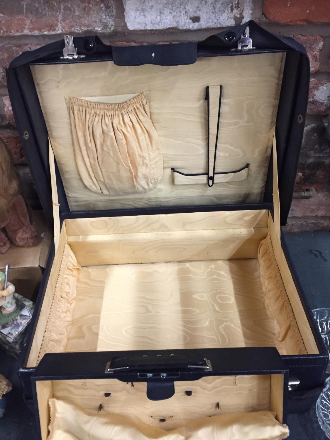 A LARGE AND SMALLER VINTAGE CASE WITH SILK INTERIOR