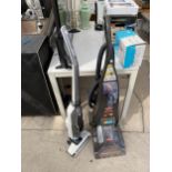 A BISSELL CARPET CLEANER AND A BOSCH STICK VACUUM