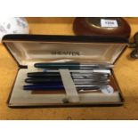 A SHEAFFER BOX TOGETHER WITH A VARIETY OF PENS