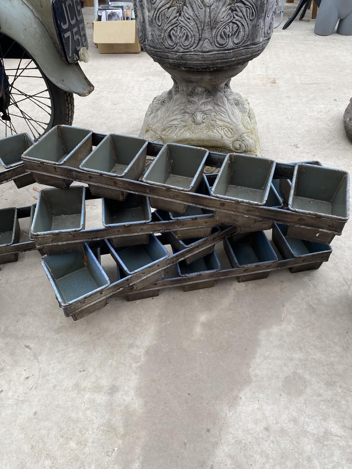 THREE VINTAGE METAL FIVE SECTION BREAD MOULDS