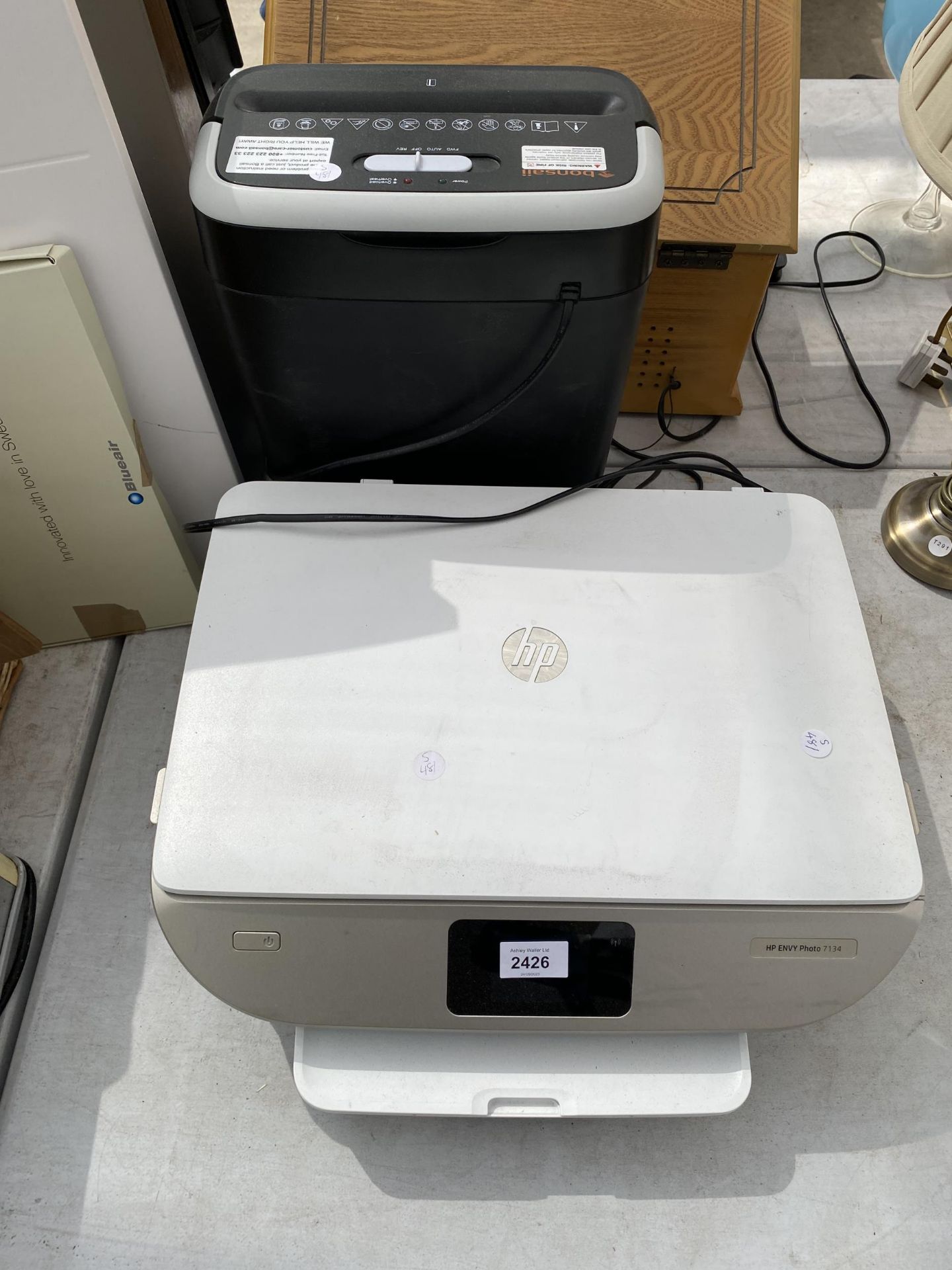 A HP PRINTER AND A PAPER SHREDDER