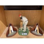 A CAST IRON CRICKET DOORSTOP AND CRICKET BOOKENDS