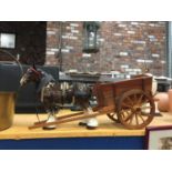 A LARGE VINTAGE SHIRE HORSE WITH HARNESS AND CART