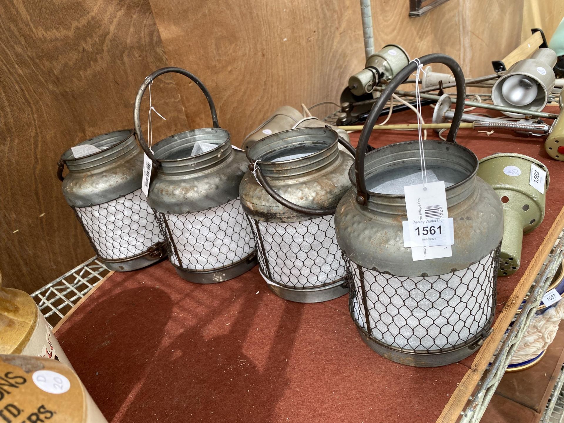 A SET OF FOUR VINTAGE STYLE METAL CANDLE LANTERN HOLDERS