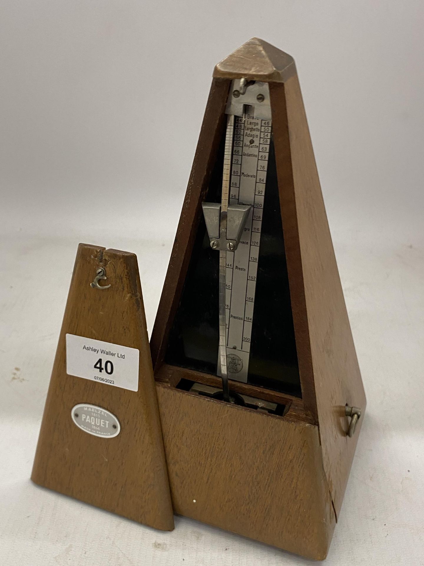 A VINTAGE FRENCH 'PAQUET' WOODEN CASED METRONOME