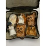 A METAL BOX OF STAFFORDSHIRE PIN CUSION DOG HEADS