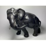 AN EARLY 20TH CENTURY JAPANESE METAL MODEL OF AN ELEPHANT, 20 X 27CM