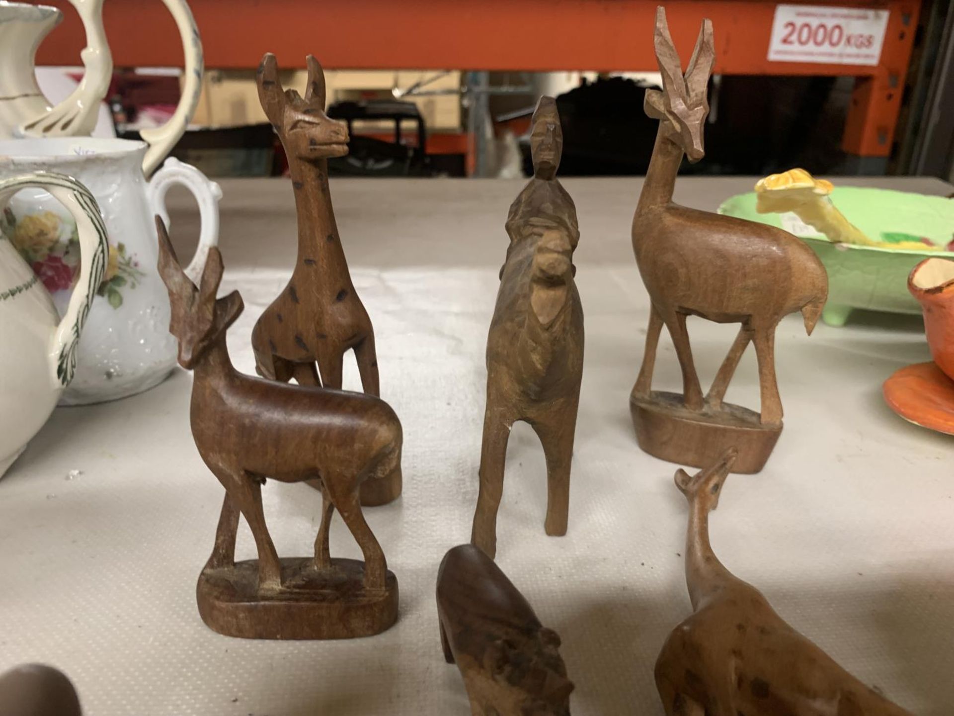 A QUANTITY OF TREEN ANIMALS TO INCLUDE GAZELLES, GIRAFFES, CAMEL, ETC PLUS TETLEY TEA COLLECTABLE - Image 4 of 4