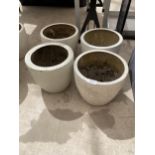 FOUR LOW WHITE CIRCULAR FIBRE GLASS PLANTERS (H:20CM)