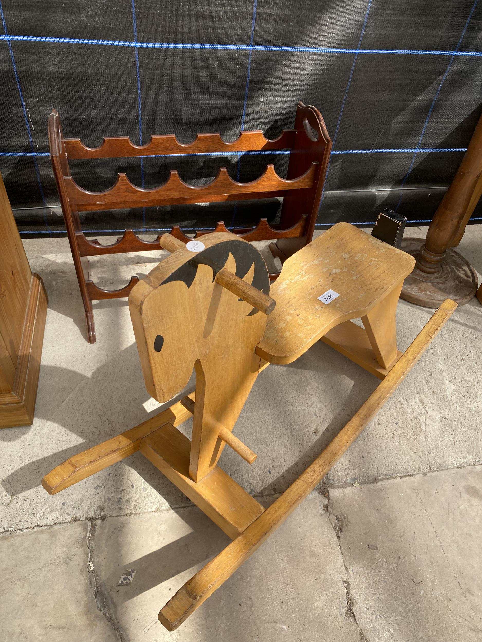 A MODERN HARDWOOD ROCKING HORSE/CHAIR AND FIFTEEN BOTTLE WINE RACK