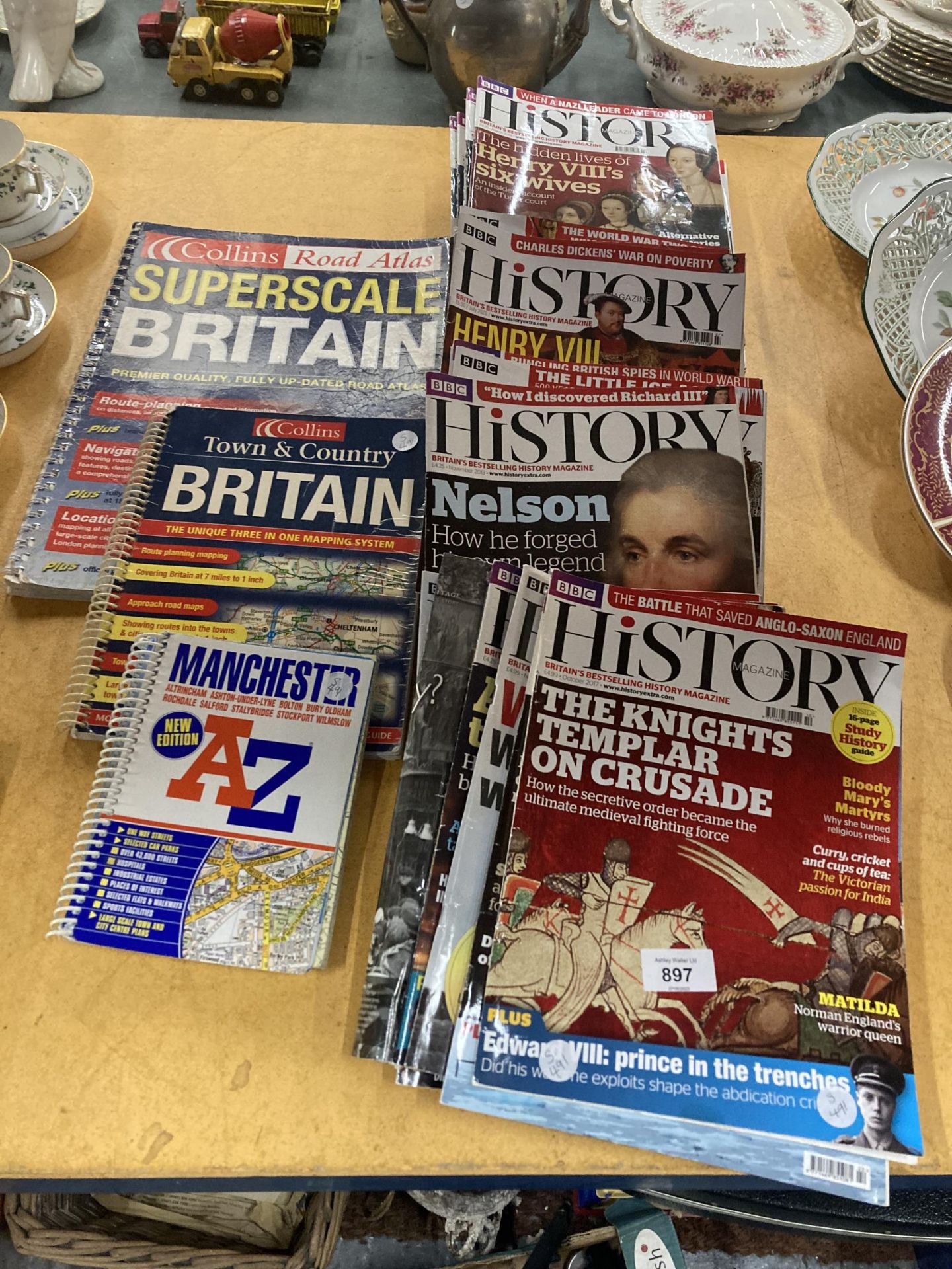 A LARGE QUANTITY OF THE BBC HISTORY MAGAZINE PLUS TWO COLLINS ROAD ATLAS' AND A MANCHESTER A-Z