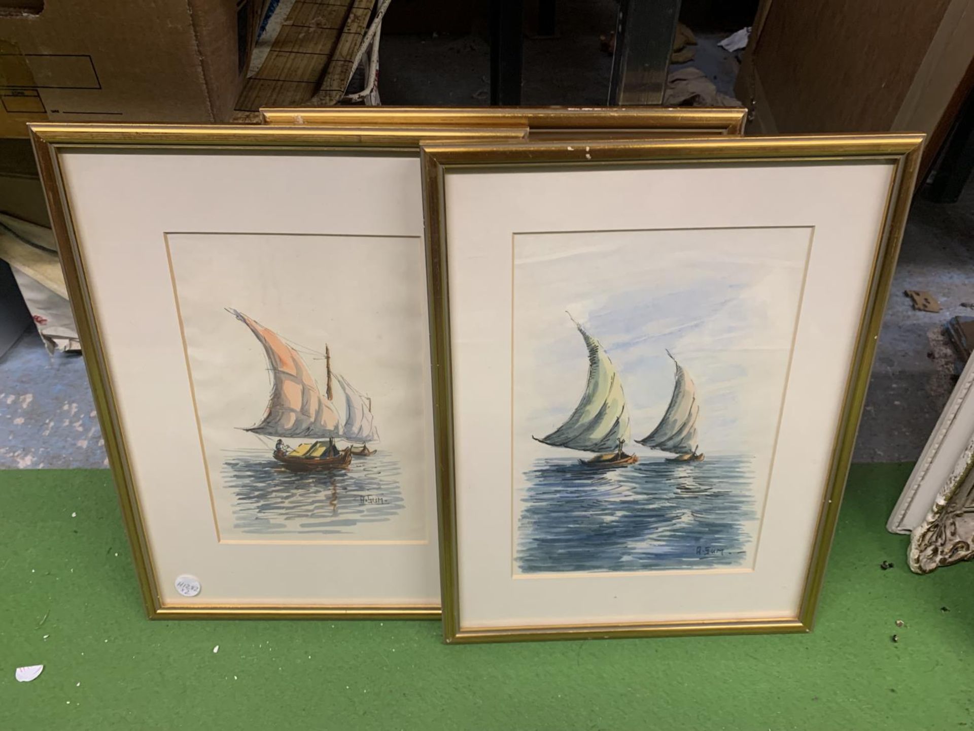 THREE FRAMED WATERCOLOURS OF BOATS SIGNED A SUM