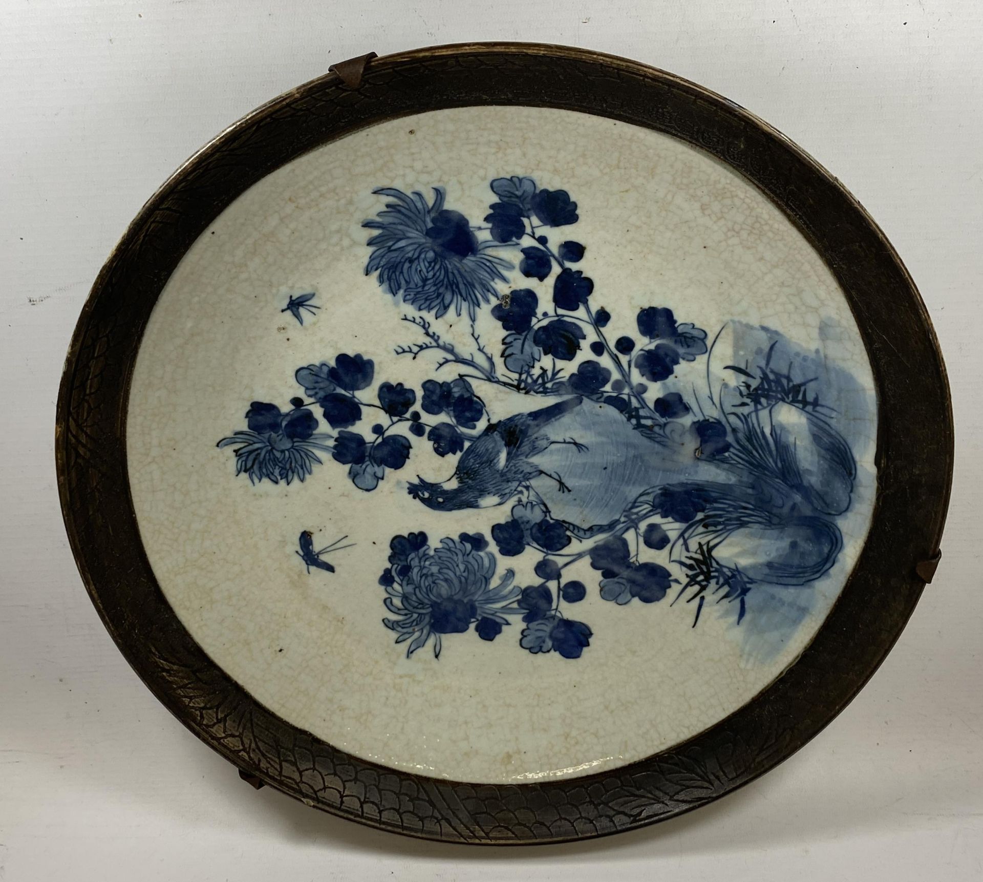 A LARGE CHINESE CRACKLE GLAZE BLUE AND WHITE FLORAL CHARGER, A/F, DIAMETER 39CM