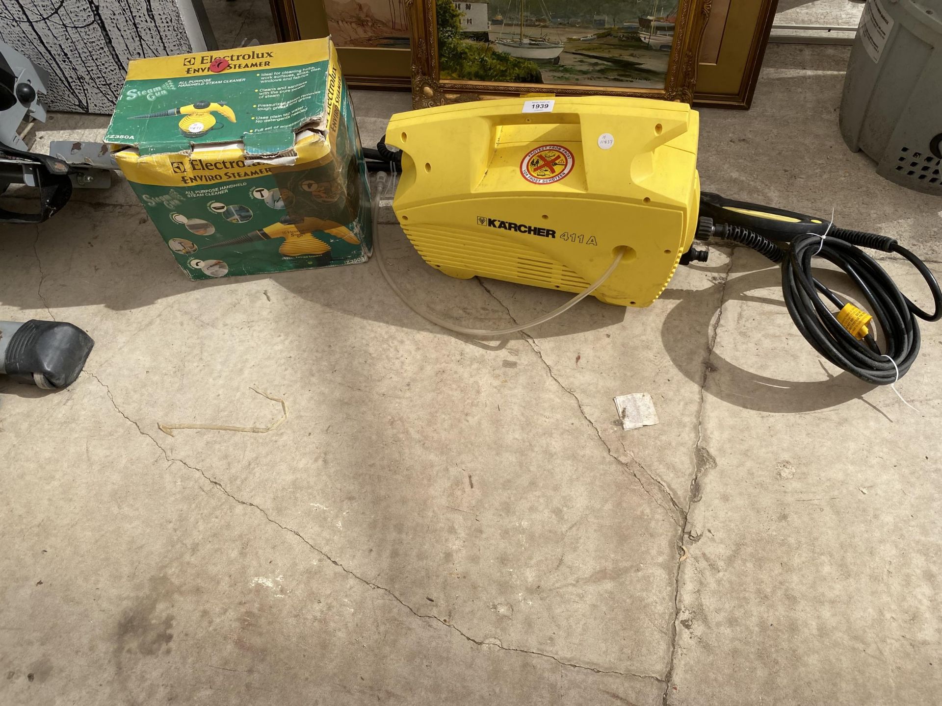 A KARCHER 411A ELECTRIC PRESSURE WASHER AND AN ELECTROLUX STEAMER