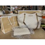 A MICHAEL KORS MATCHING HANDBAG AND PURSE SET WITH BAGS