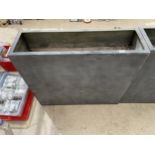 A TALL BLACK RECTANGULAR FIBRE GLASS TROUGH PLANTER (100CM x 90CM x 30CM)