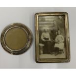TWO HALLMARKED SILVER PHOTO FRAMES, LARGEST 15.5 X 10 CM
