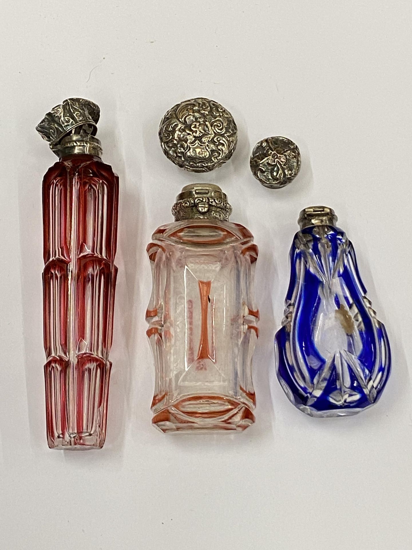 A COLLECTION OF SILVER TOPPED PERFUME BOTTLES, A/F