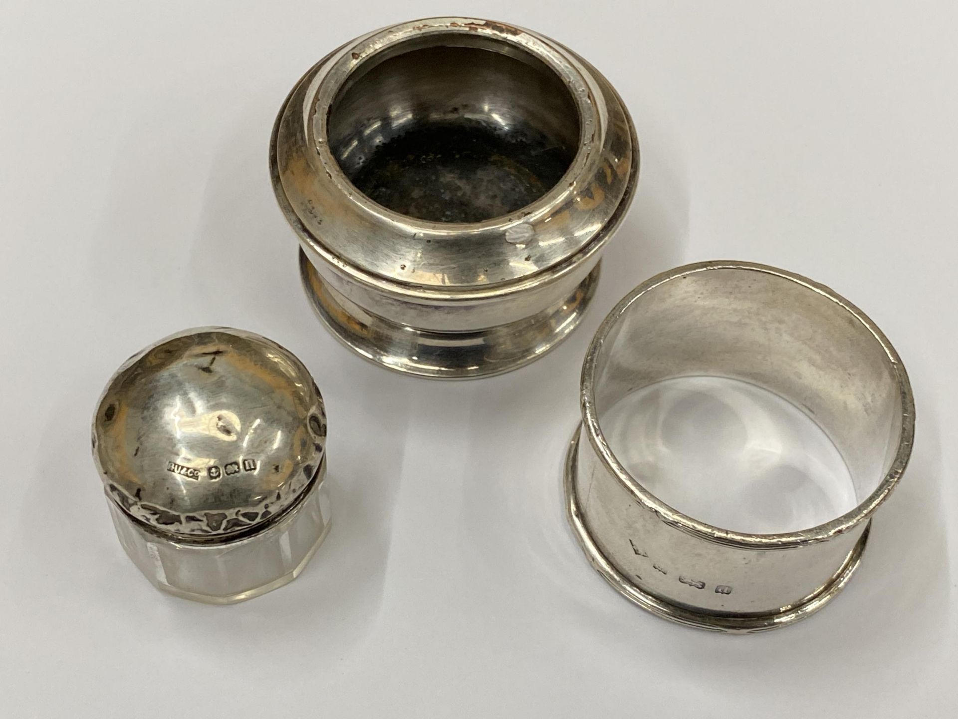 THREE PIECES OF SILVER- NAPKIN RING, GLASS AND SILVER POT AND FURTHER INKWELL