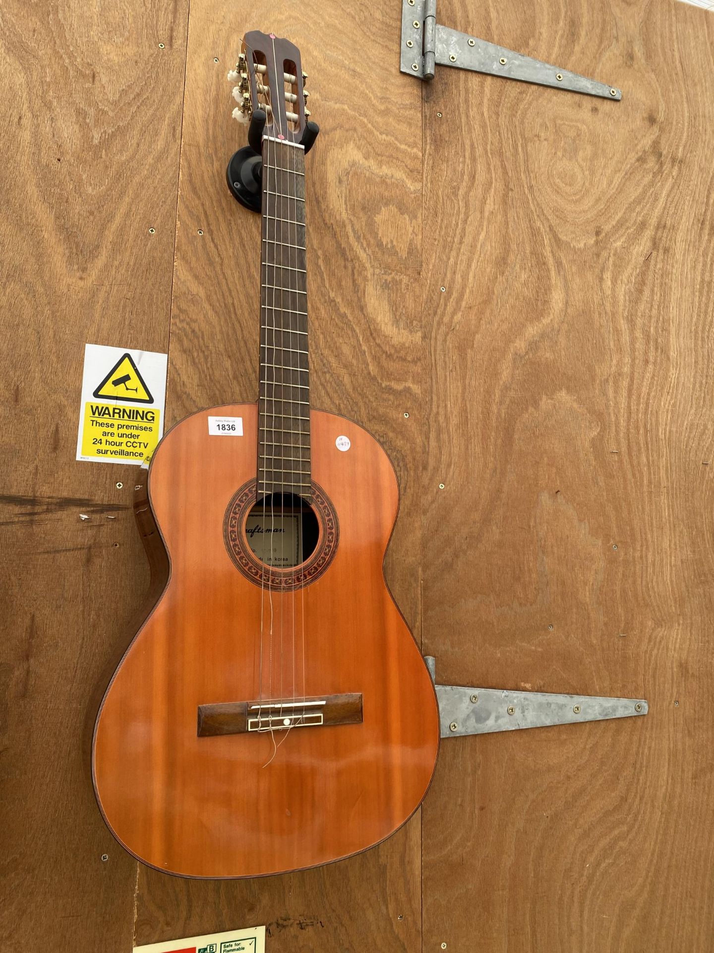 A CRAFTSMAN SC-709 ACOUSTIC GUITAR REQUIRES RESTRINGING