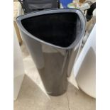 A BLACK TRIANGLUR PLASTIC PLANTER (H:75CM)