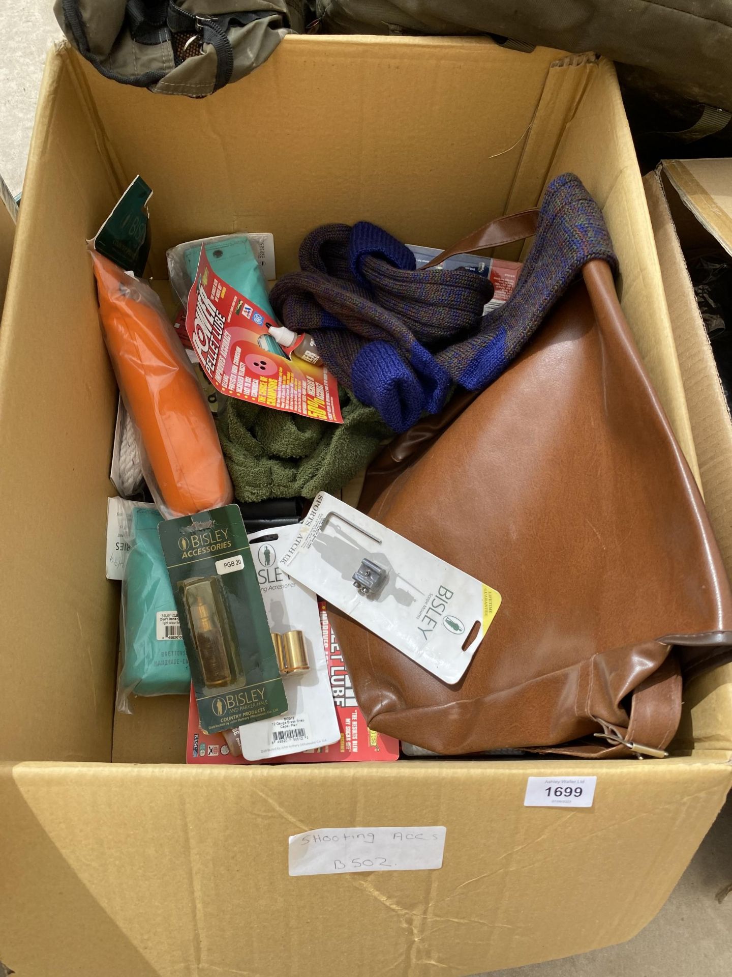 A BOX CONTAINING AS NEW SHOOTING ACCESSORIES TO INCLUDE SOCKS AND BAGS ETC (FROM A TACKLE SHOP