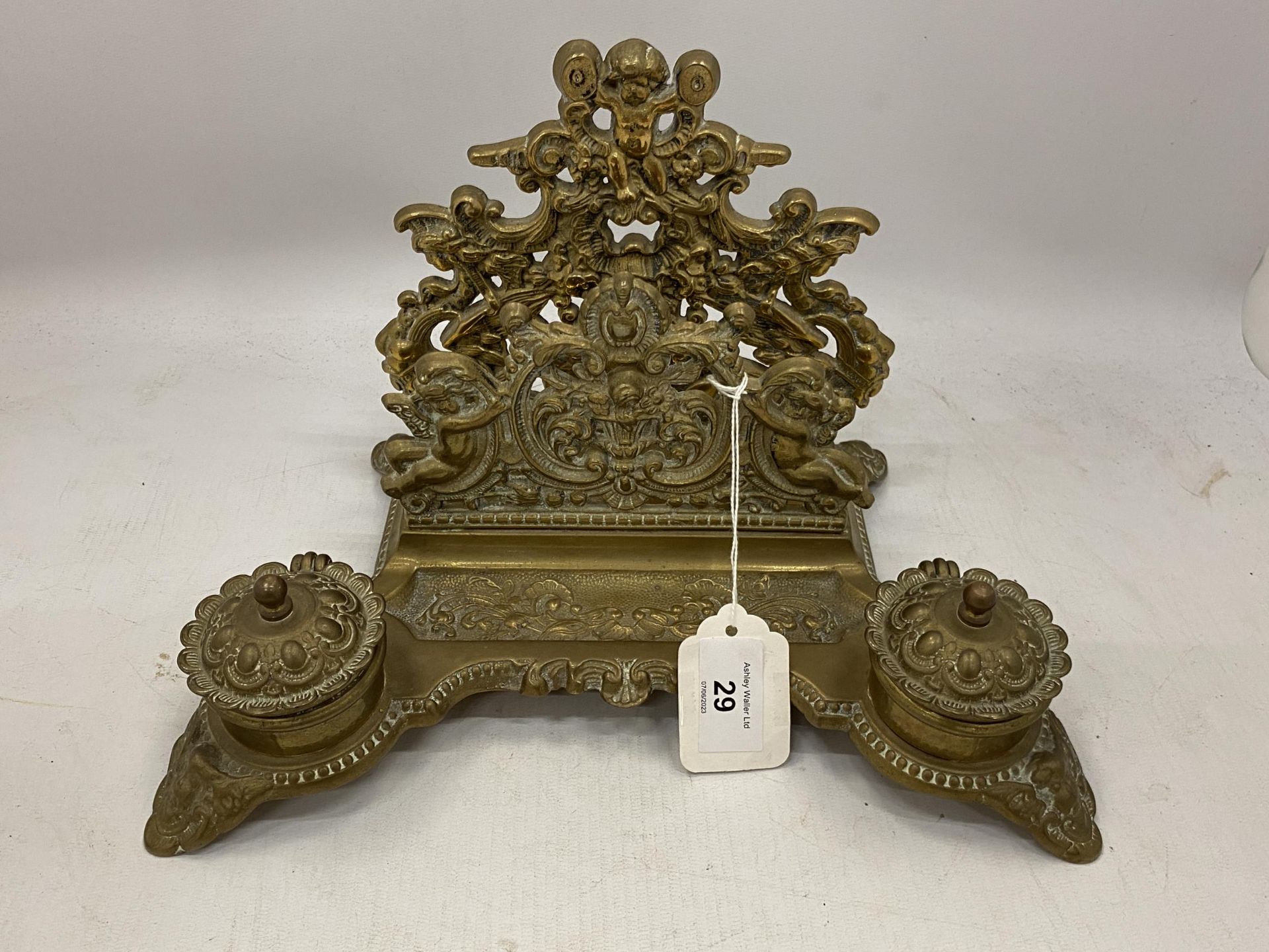 A VINTAGE BRASS DESK SET INCLUDING INKWELLS AND A LETTER RACK