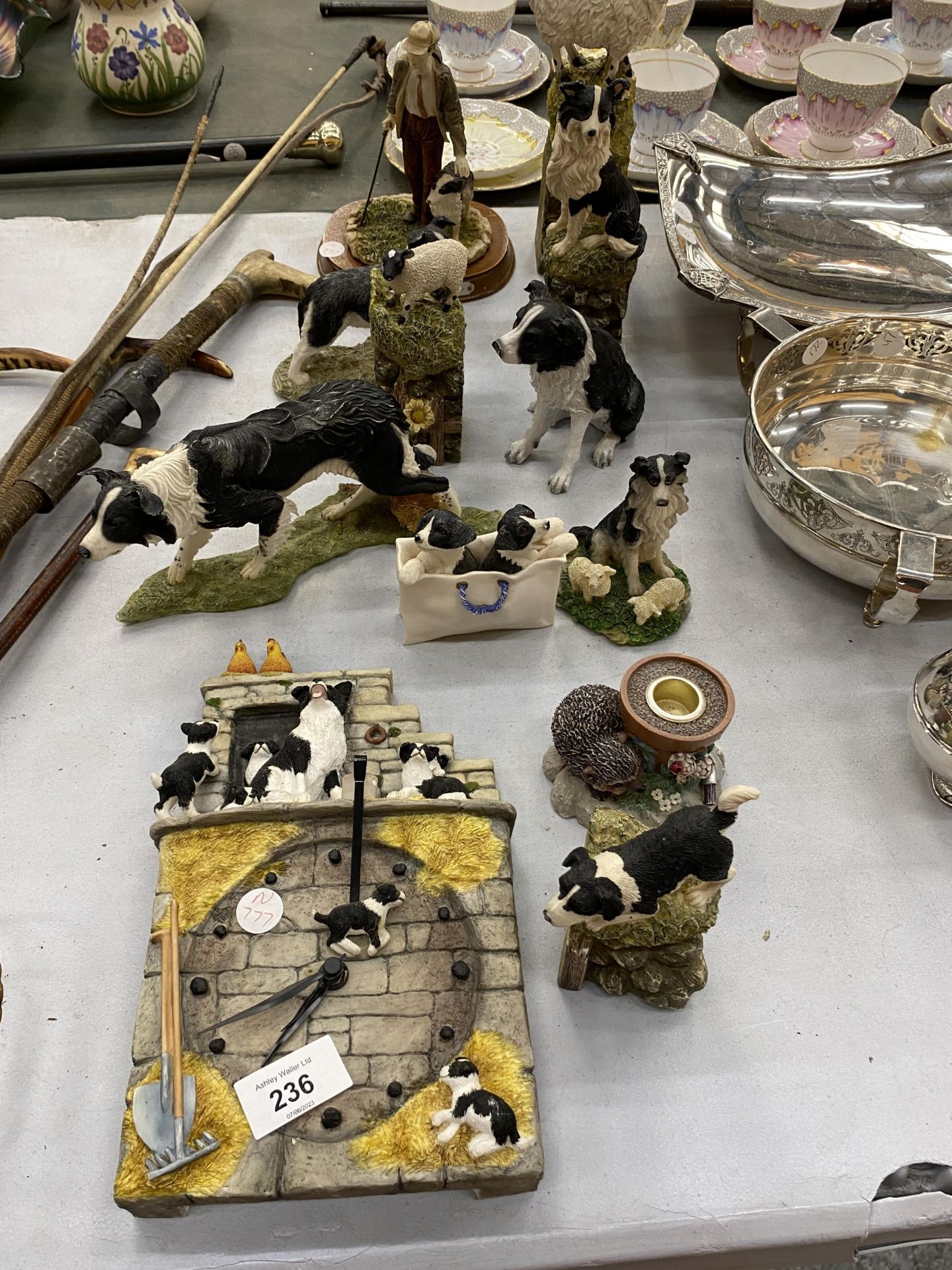 A LARGE QUANTITY OF BORDER COLLIE AND SHEEP FIGURES TO INCLUDE A JAMES HERRIOT WALL CLOCK,