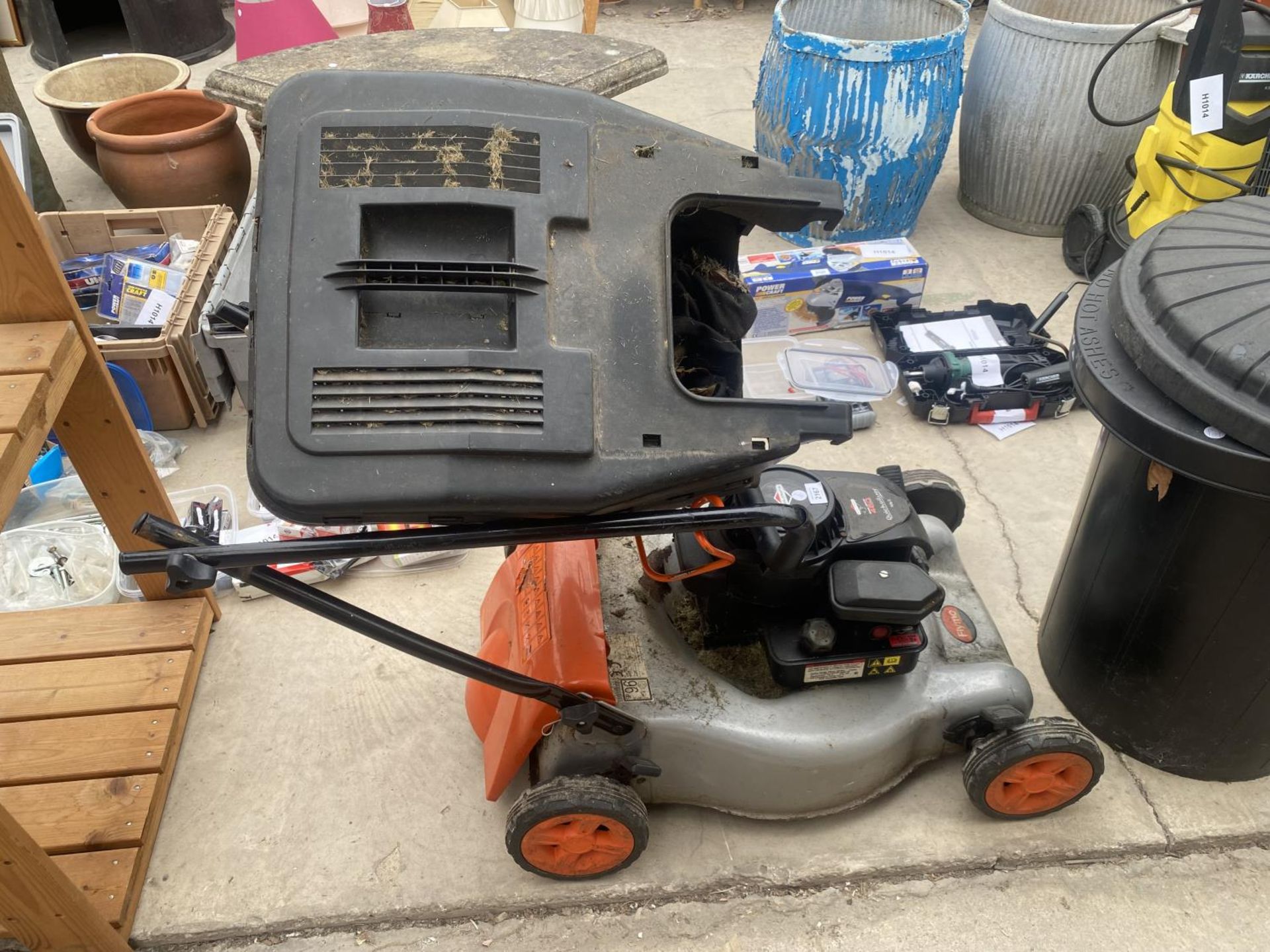 A FLYMO PETROL LAWN MOWER WITH GRASS BOX