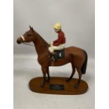 A BESWICK RED RUM HORSE AND JOCKEY FIGURE ON WOODEN PLINTH BASE, HEIGHT 35CM