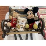 A CAST VINTAGE SMALL SWINGING SEAT WITH STAND PLUS MICKEY MOUSE AND TEDDY PLUSH FIGURES AND A MUG