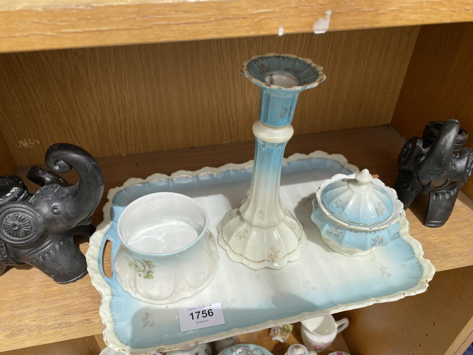 A CERAMIC DRESSING TABLE SET AND TWO TREEN ELEPHANT CANDLE STICKS - Image 2 of 3