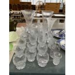 AN ASSORTMENT OF GLASS WARE TO INCLUDE VASES, WHISKEY GLASSES ETC