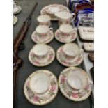 A ROYAL WORCESTER 'ROYAL GARDEN' TEASET TO INCLUDE A CAKE PLATE, CREAM JUG, SUGAR BOWL, CUPS,